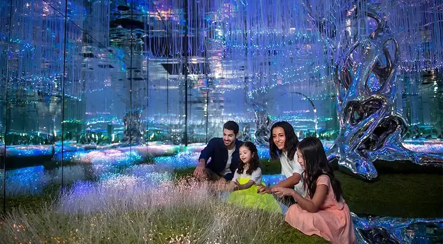 Entrance to Aya Universe Dubai with vibrant lights and futuristic design.